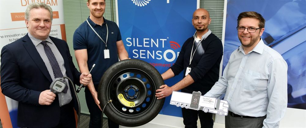 Engineers testing a tyre sensor system in a workshop